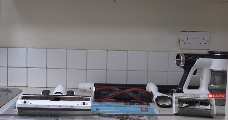 A person dissemble vacuum parts to clean the vacuum deeply