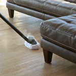 Cleaning a hardwood floor with steam vacuum cleaner